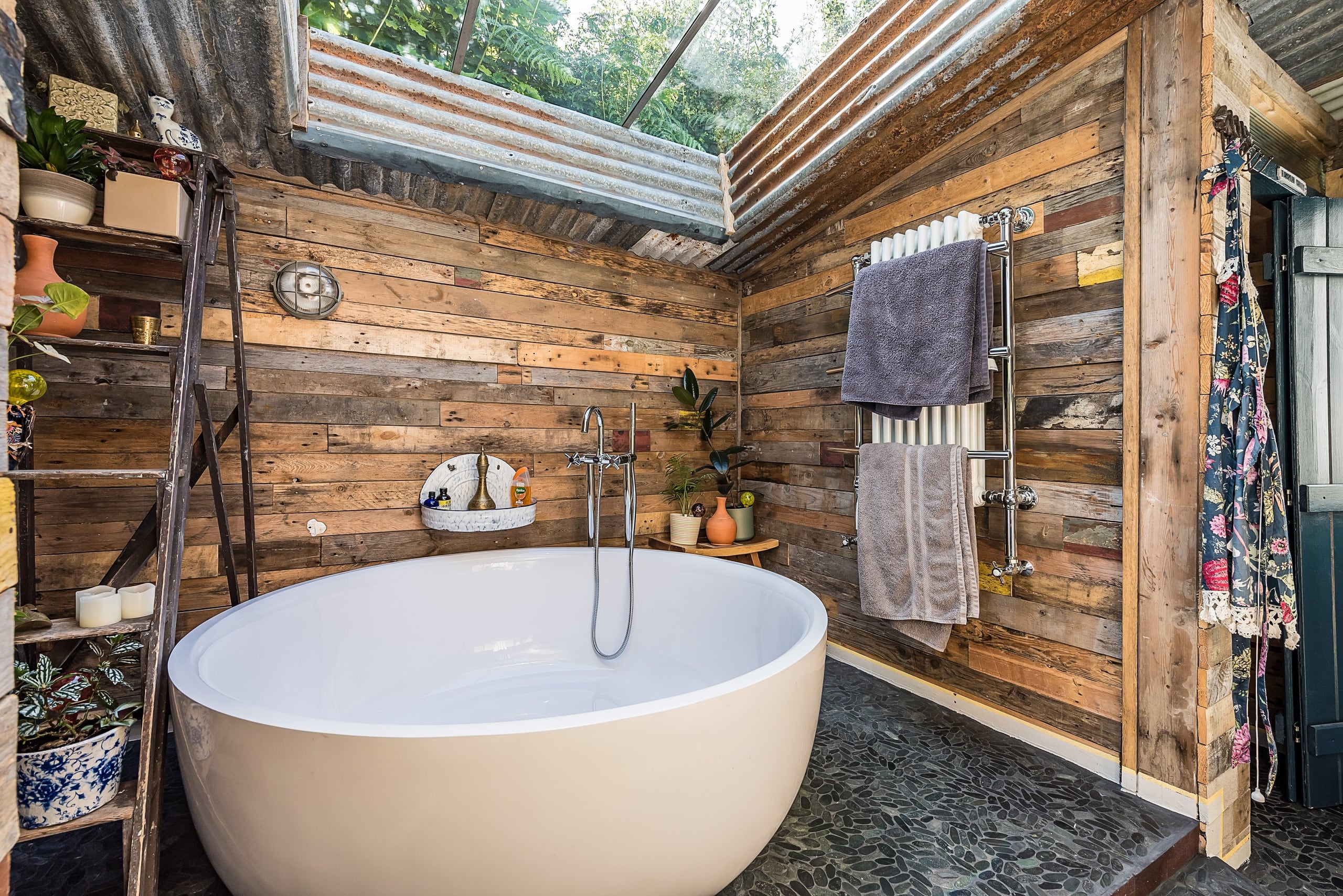 Two-person indoor soaking bathtub beneath a skylight at Apple Tree Cottage